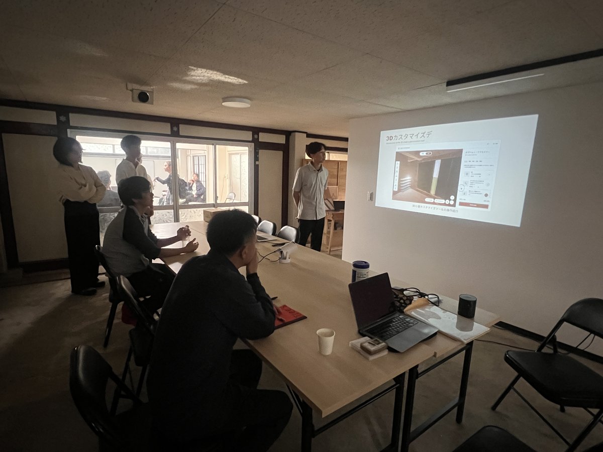 Project presentation and team discussion during DX workshop